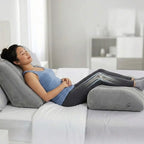 Deflated leg elevation pillow packed in travel pouch with passport and headphones