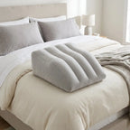 Adjustable firmness of leg elevation pillow with hand compressing surface